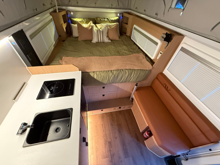 Trekka interior with queen bed and kitchen