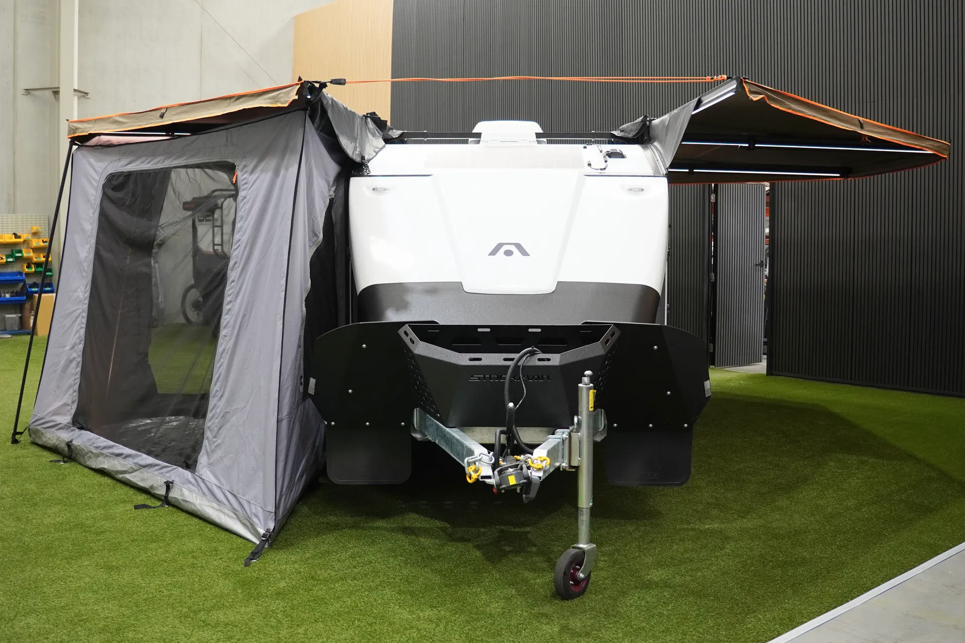 Driver-side change room set up beside the Rover 02 with the awning extended