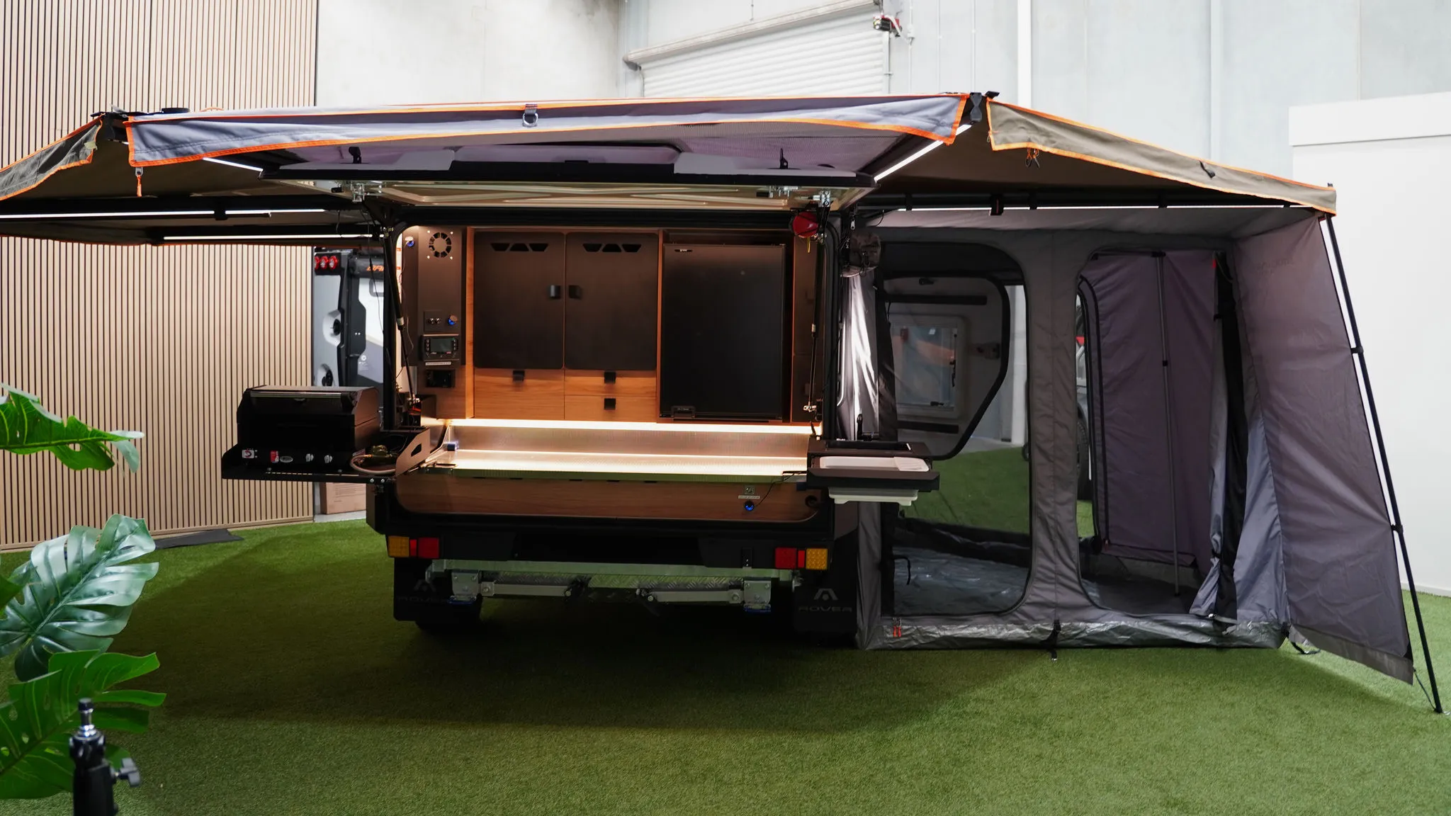 Full camp setup — Rover 02 kitchen, awning and driver-side change room