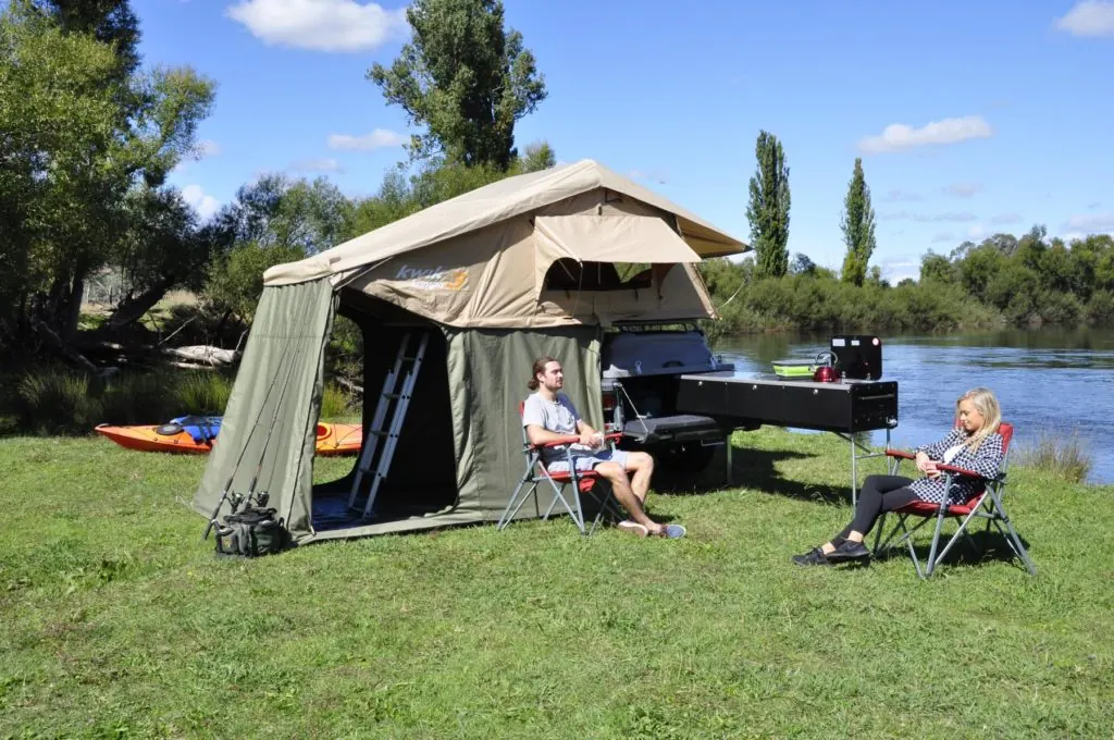 Pod Trailer set up with a roof-top tent at camp