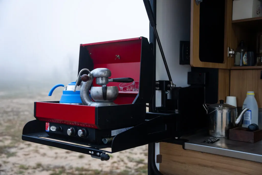 Stockman Rover 02 swing-out cooker in use at camp