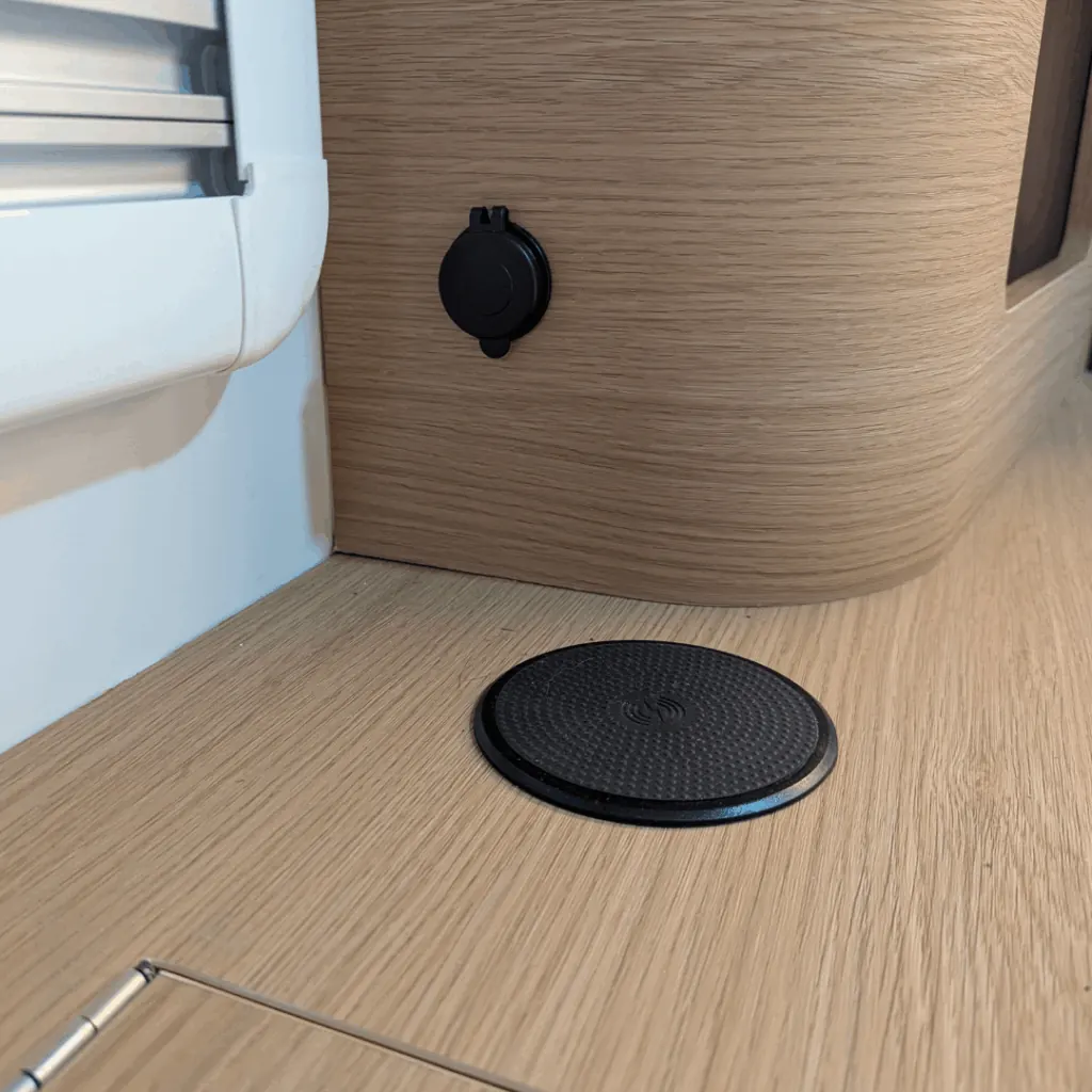 Wireless phone charging pad and power outlet inside the Trekka 01 cabin