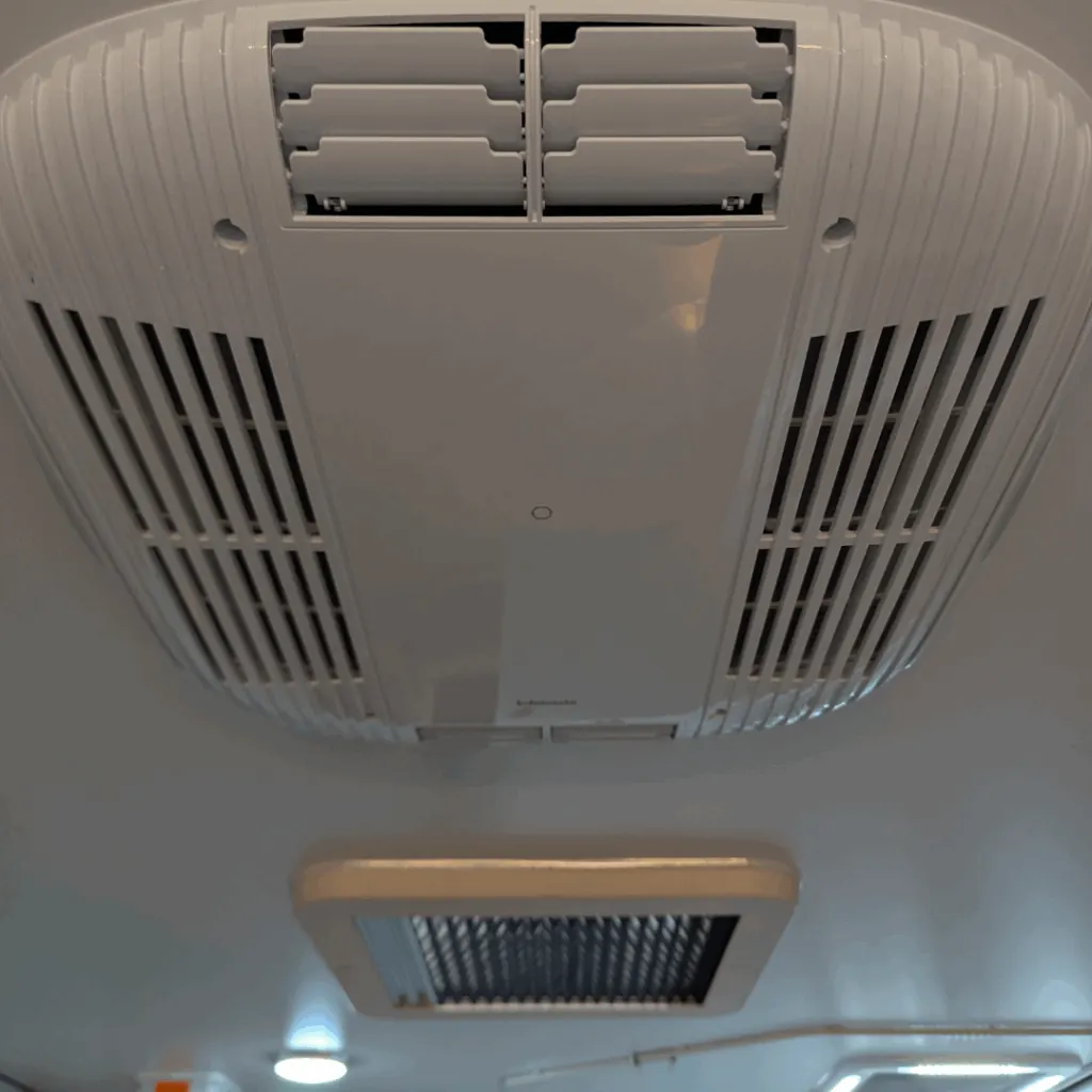 Roof-mounted air-conditioning vents in the Trekka 01 cabin ceiling