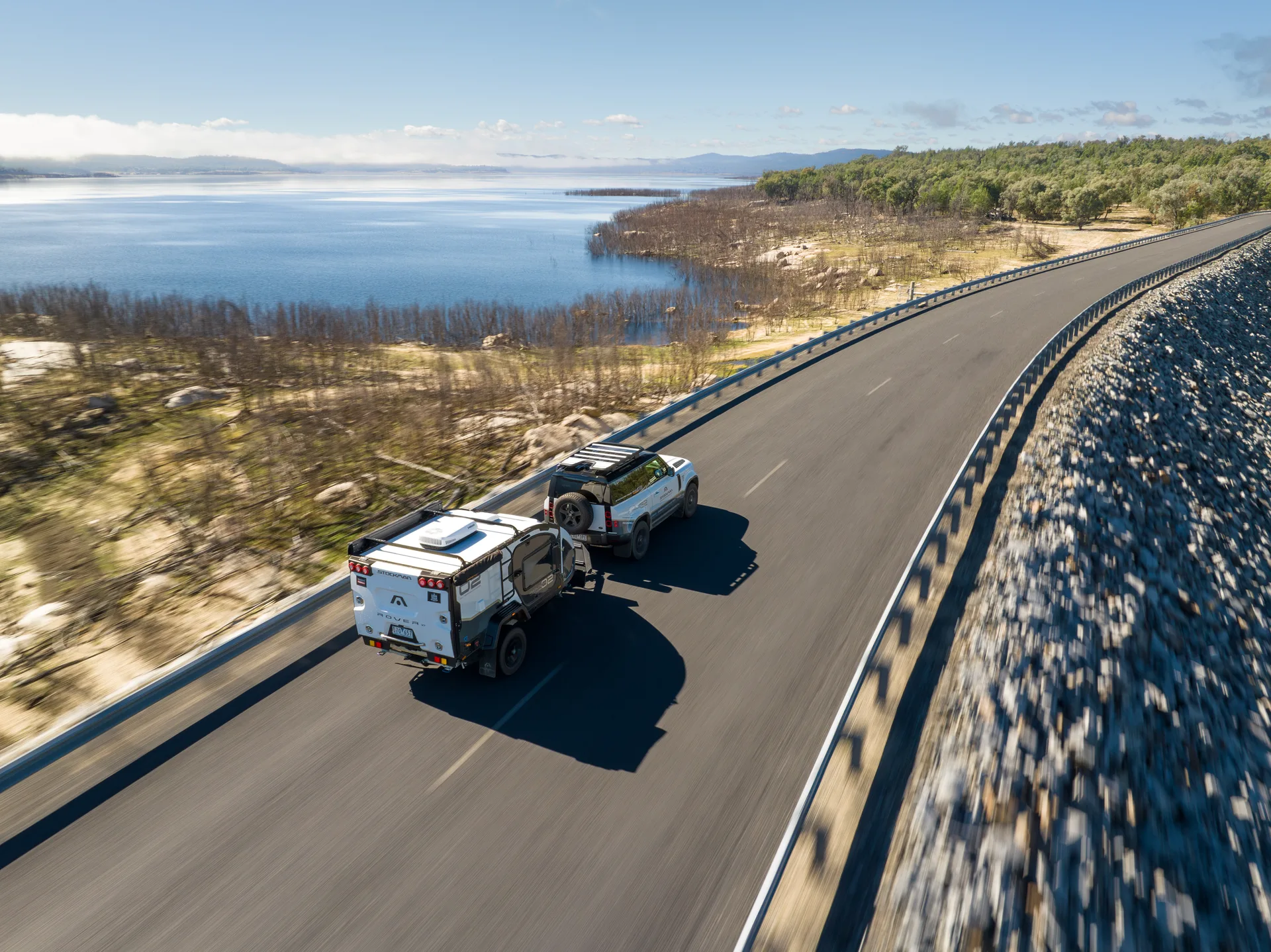 Aerial view of a Stockman Rover 02 towed along a lakeside road